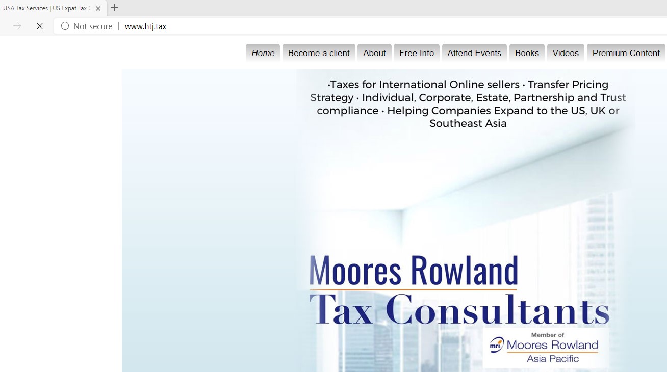Moores Rowland Tax Consultants website with navigation links and services listed.