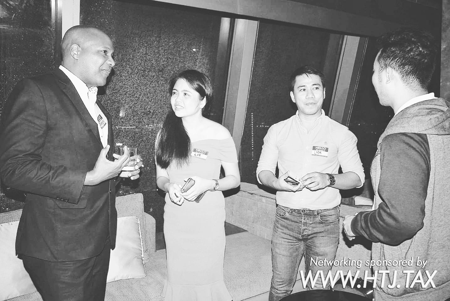 Four people networking. Text overlay: Networking sponsored by WWW.HTJ.TAX.