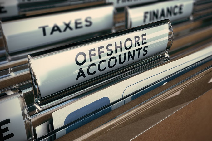 File folders labeled Taxes, Offshore Accounts, and Finance.