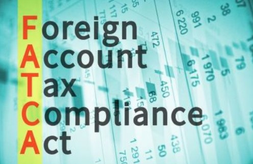 Text reads Foreign Account Tax Compliance Act over a financial chart.