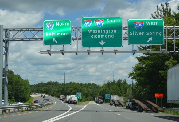 Highway signs for I-95 North to Baltimore, I-95 South to Washington Richmond, and I-495 West to Silver Spring.