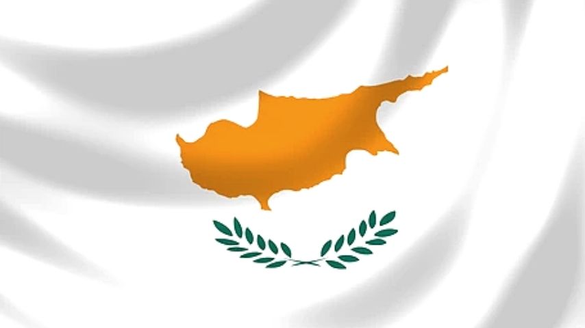 Flag of Cyprus with an orange map of the island and green olive branches.