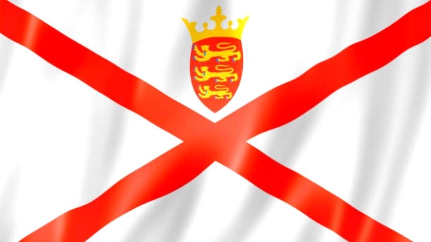 Flag of Jersey with a red saltire and a shield with three lions under a crown.