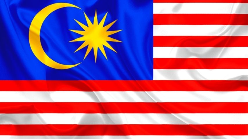 Flag of Malaysia with red and white stripes and a blue canton with a yellow crescent and star.