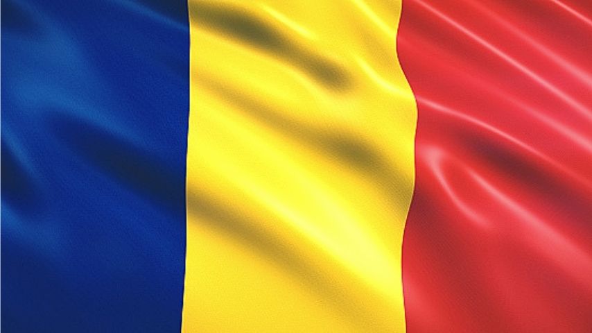 The flag of Romania, a vertical tricolor of blue, yellow, and red.
