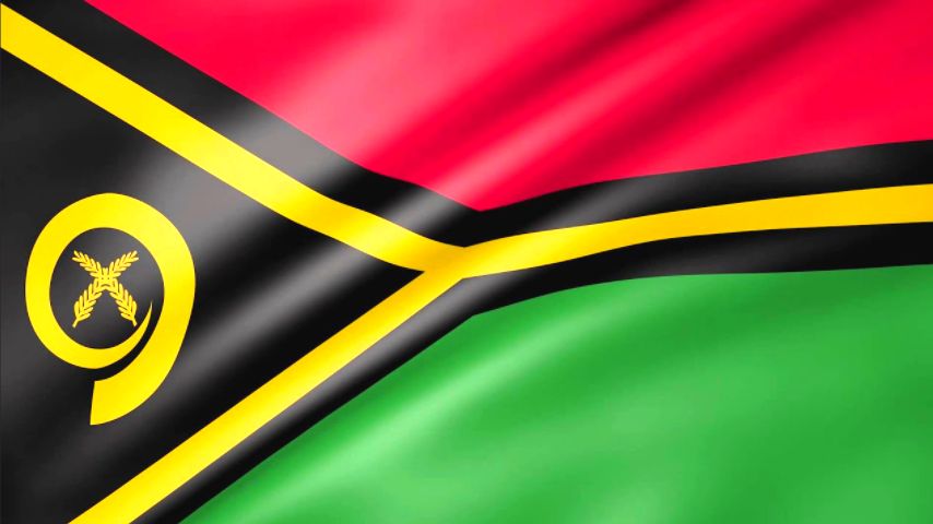 Flag of Vanuatu with red, black, yellow, and green colors and a boar's tusk emblem.