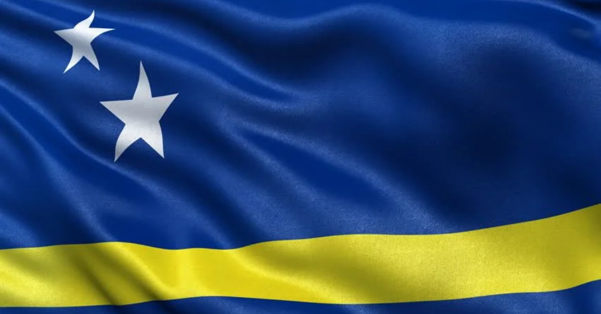 Flag of Curacao with blue field, yellow stripe, and two white stars.