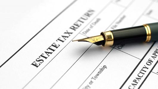 Estate Tax Return form with a fountain pen resting on it.